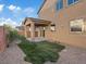 Backyard with minimal landscaping including a covered patio at 6178 Pisan Ln, Las Vegas, NV 89148