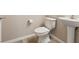 Small half bathroom featuring a pedestal sink, and a standard toilet at 6178 Pisan Ln, Las Vegas, NV 89148