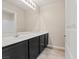 Modern bathroom with a long vanity and a large mirror at 6178 Pisan Ln, Las Vegas, NV 89148