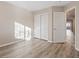 Bright bedroom with wood-look floors, closet, and natural light makes it an excellent home feature at 6178 Pisan Ln, Las Vegas, NV 89148