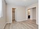 Bright, neutral bedroom featuring wood floors and a closet at 6178 Pisan Ln, Las Vegas, NV 89148