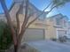 Two-story house with attached garage and landscaping at 6178 Pisan Ln, Las Vegas, NV 89148