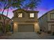 Charming two-story home with a two-car garage, desert landscaping, and neutral-toned stucco in a residential neighborhood at 6178 Pisan Ln, Las Vegas, NV 89148