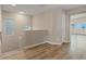 Bright hallway with natural light, wood-look floors, and neutral paint, creating a welcoming transition between spaces at 6178 Pisan Ln, Las Vegas, NV 89148