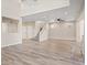 Spacious living room featuring wood-look flooring, open floor plan, and high ceilings, creating an airy atmosphere at 6178 Pisan Ln, Las Vegas, NV 89148