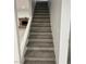 Modern staircase with gray carpeting leading to the upper level at 6240 Viewpoint Dr, Las Vegas, NV 89156