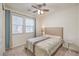 Cozy bedroom with window coverings and ceiling fan at 6403 Ava Ridge Ave, Las Vegas, NV 89141