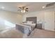 Well-lit bedroom featuring a comfortable bed and neutral color scheme at 6403 Ava Ridge Ave, Las Vegas, NV 89141