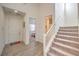 Bright and spacious entryway with staircase and tile flooring at 6403 Ava Ridge Ave, Las Vegas, NV 89141