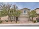 Two-story house with attached garage and landscaped front yard at 6403 Ava Ridge Ave, Las Vegas, NV 89141