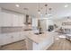 Spacious kitchen with island, stainless steel appliances, and white cabinetry at 6403 Ava Ridge Ave, Las Vegas, NV 89141