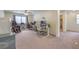 Bright home office with desk, comfortable chair, and ample natural light at 6403 Ava Ridge Ave, Las Vegas, NV 89141