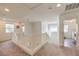 Upstairs hallway with access to bedrooms and laundry at 6403 Ava Ridge Ave, Las Vegas, NV 89141