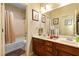 Bathroom with double vanity, shower, and bathtub at 6422 Hughes Springs Dr, Las Vegas, NV 89131