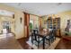 Elegant dining room with hardwood floors, large table, and built-in hutch at 6422 Hughes Springs Dr, Las Vegas, NV 89131