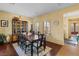 Bright dining room featuring hardwood floors and a formal dining setting at 6422 Hughes Springs Dr, Las Vegas, NV 89131