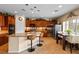 Modern kitchen with curved island and breakfast bar at 6422 Hughes Springs Dr, Las Vegas, NV 89131