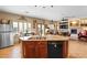 Large kitchen island with seating and views of the living area at 6422 Hughes Springs Dr, Las Vegas, NV 89131