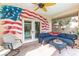 Relaxing covered patio with American flag mural and comfortable seating at 6422 Hughes Springs Dr, Las Vegas, NV 89131