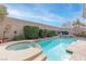 Relaxing pool and spa area with seating and landscaping at 6422 Hughes Springs Dr, Las Vegas, NV 89131