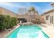 Resort style backyard with a large pool and spa at 6422 Hughes Springs Dr, Las Vegas, NV 89131