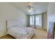 Bedroom with bay window, ceiling fan, and carpeted floor at 6860 Coral Rock Dr, Las Vegas, NV 89108