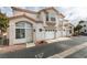 Two-story home with attached garage and landscaping at 6860 Coral Rock Dr, Las Vegas, NV 89108