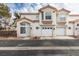 Two-story home with attached two-car garage and landscaping at 6860 Coral Rock Dr, Las Vegas, NV 89108