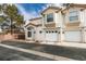 Front view of two-story home with attached garage at 6860 Coral Rock Dr, Las Vegas, NV 89108