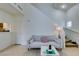 Cozy living room with light gray sofa and a view of the staircase at 6860 Coral Rock Dr, Las Vegas, NV 89108