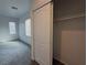 Bedroom with sliding closet doors and window at 690 Calamus Palm Pl, Henderson, NV 89011