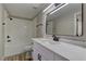 Modern bathroom with white vanity and marble countertop at 6955 N Durango Dr # 1048, Las Vegas, NV 89149