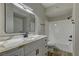 Modern bathroom with white vanity and marble countertop at 6955 N Durango Dr # 1048, Las Vegas, NV 89149