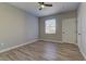 Spacious bedroom with ceiling fan and wood-look flooring at 6955 N Durango Dr # 1048, Las Vegas, NV 89149