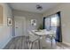 Virtually staged dining area with marble-top table and modern chairs at 6955 N Durango Dr # 1048, Las Vegas, NV 89149