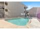 Community pool and spa with surrounding patio at 700 Capri Dr # 34C, Boulder City, NV 89005