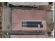 Aerial view of house with red tile roof, solar panels, and well-maintained surroundings at 7129 Flora Lam St, Las Vegas, NV 89166