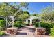 Brick pathway with arch and pergola in community at 7129 Flora Lam St, Las Vegas, NV 89166