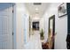 Bright hallway with white tile flooring, recessed lighting, and tasteful decorations at 7129 Flora Lam St, Las Vegas, NV 89166