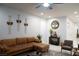 Living room with sectional sofa, wall decor, and area rug at 7129 Flora Lam St, Las Vegas, NV 89166