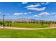 Large grassy park area with walking path at 7129 Flora Lam St, Las Vegas, NV 89166