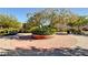 Beautiful park area with circular brick paving and mature landscaping, creating a peaceful outdoor space at 7129 Flora Lam St, Las Vegas, NV 89166