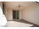 Relaxing covered patio with ceiling fan, tile flooring, and a sliding door for indoor-outdoor living at 7129 Flora Lam St, Las Vegas, NV 89166