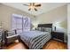 Well-lit bedroom with wood floors, a comfy bed, and a ceiling fan at 7173 S Durango Dr # 212, Las Vegas, NV 89113