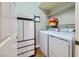 Convenient laundry room with washer, dryer, and storage at 7173 S Durango Dr # 212, Las Vegas, NV 89113