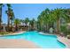 Inviting community pool surrounded by lush landscaping at 7173 S Durango Dr # 212, Las Vegas, NV 89113