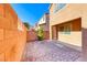 Backyard with brick wall and paved patio at 7683 Jasmine Falls Dr, Las Vegas, NV 89179