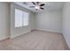 Well-lit bedroom with ceiling fan and window at 7683 Jasmine Falls Dr, Las Vegas, NV 89179