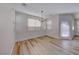 Bright dining room with chandelier and wood-look floors at 7683 Jasmine Falls Dr, Las Vegas, NV 89179