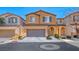 Two story house with a two car garage and landscaped front yard at 7683 Jasmine Falls Dr, Las Vegas, NV 89179